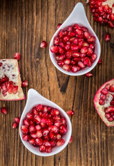 Wooden table with Pomegranate (selective focus)