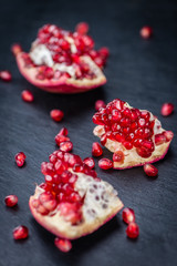 Pomegranate on a slate slab (selective focus)