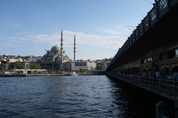 Galata Bridge and Yeni Camii Mosque at the Golden Horn in Istanbul, Turkey