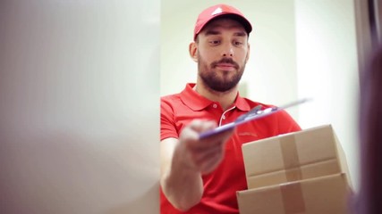 happy man delivering parcel boxes to customer home