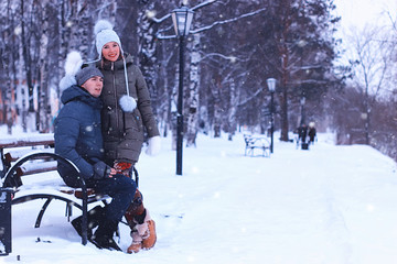Fototapeta na wymiar couple lover winter street bench