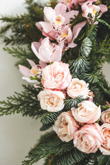Florist makes Christmas wreath in workshop