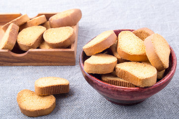 Slices of dried bread in an old brown wooden crockery