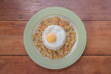 rice with spicy curry and fried egg
