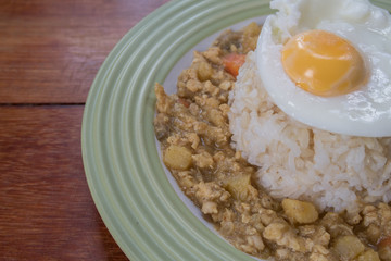 rice with spicy curry and fried egg