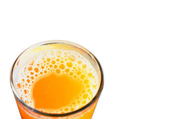 Glass of orange juice from above on white background.