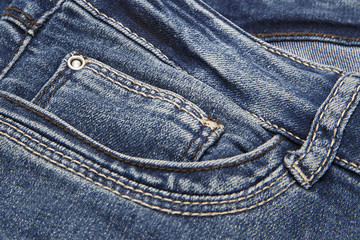 Fototapeta premium Fragment of dark blue jeans