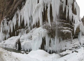 Fototapeta na wymiar Frozen beautiful waterfall in winter