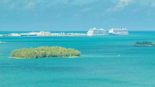 Overlooking King's Wharf, Bermuda with Two Large Cruise Ships Docked in the Royal Navy Dockyard. Featuring Turquoise Water, Green Islands and a Blue Sky on a Sunny Day