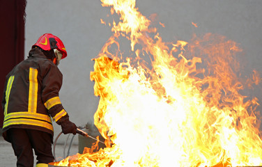 Firefighter during a training exercise off a huge fire in the br
