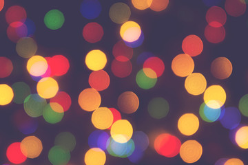 Blurred christmas lights background. De focused Light