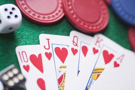 poker playcard dice on green table.Bet