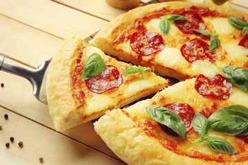 Homemade pepperoni pizza on wooden table