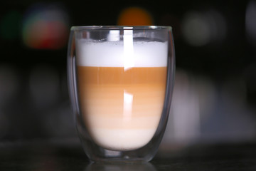 Cup of hot coffee in cafe