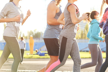 Sportsmen running at stadium