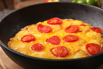 Freshly baked pizza in a pan