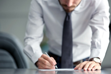Businessman signing documents