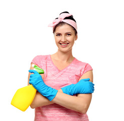 Young cleaner with spray on white background