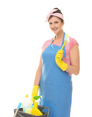 Young cleaner with cart and cleaning supplies on white background