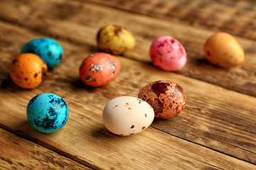 Obraz na płótnie Canvas Beautiful Easter eggs on wooden background