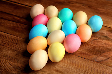 Colourful Easter eggs on wooden background
