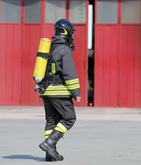 Fireman with oxygen tank to breathe during fire