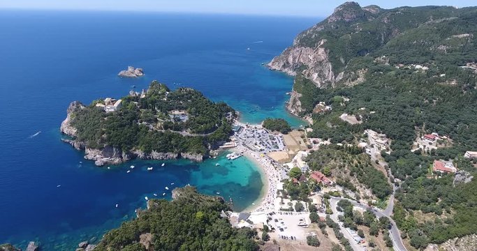 Corfu Paleokastrita bay with clear blue waters. Aerial footage from a drone. Kerkyra Island, Greece.