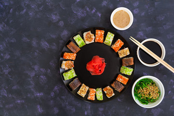 Sushi roll on dark background. Top view