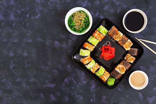 Sushi roll on dark background. Top view