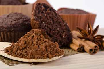 cinnamon stick, star of anise, cocoa powder and chocolate muffin