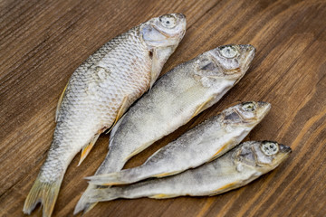 Dried fish on wooden background