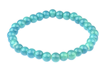 Turquoise elastic bracelet made of small pearl-like round beads, isolated on white background, clipping path included
