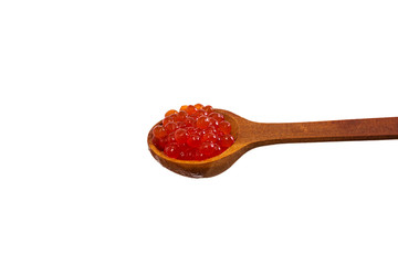 Red caviar in the wooden spoon isolated on white background.