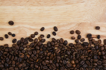 Mixture of different kinds of coffee beans on wooden background. Coffee background