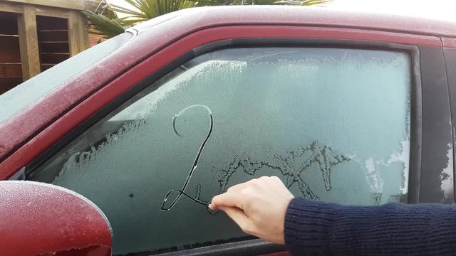 Year Number 2017 Written On Frosty Car Window By A Finger - 4K UHD Movie (3840X2160)

