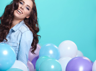 Fototapeta premium Young pretty woman with colored balloons