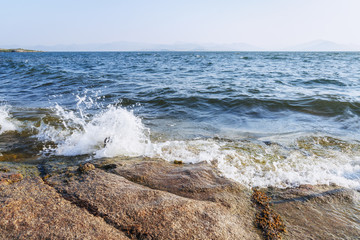 Wave/Wave beats on the rocky shore, Bukhtarma Reservoir, East Kazakhstan