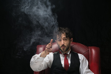 Businessman with smoking gun finger