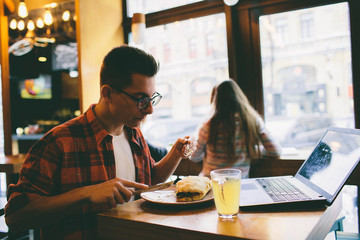 Man eating in a restaurant and enjoying delicious food