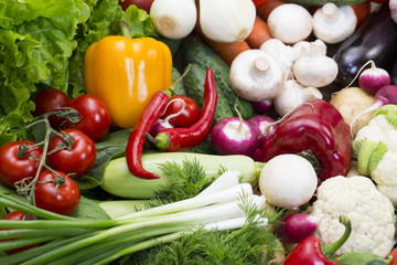 Background of fresh vegetables and greens closeup