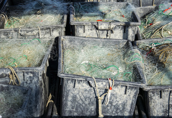  Plastic crates filled with fishing nets