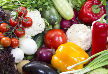Background of fresh vegetables and greens closeup
