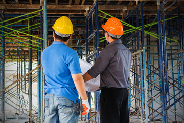 Two engineers working in a construction site