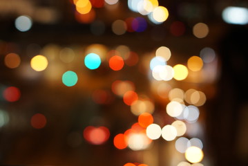 abstract blur bokeh lights from traffic jam on street at night. can use as new year background 