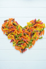 Multicolored pasta uncooked as a heart