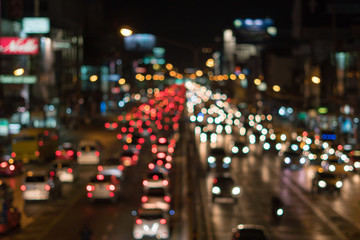 Fototapeta na wymiar Defocused lights car traffic jam of a street road at night retro
