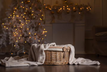 Christmas empty basket on the background of Christmas tree