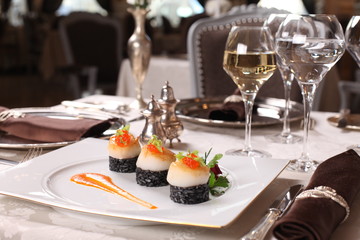 Fine dining - scallops on black rice