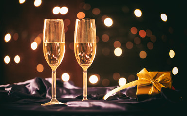 Champagne glasses on bokeh background