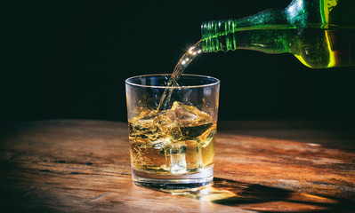 Pouring whiskey in a glass